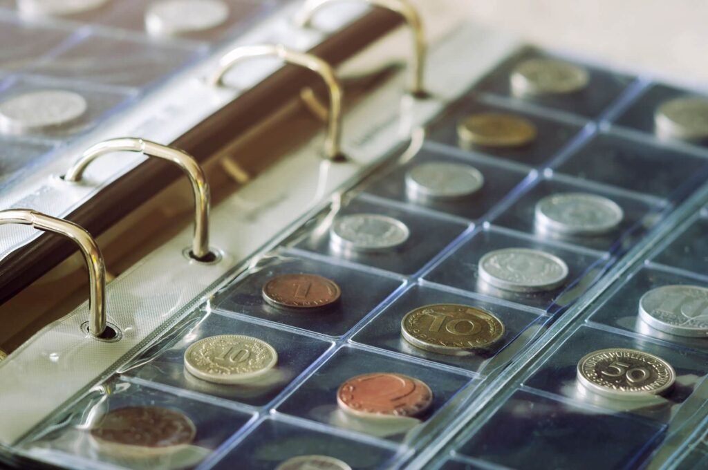 A binder of coins for Preacherbill's Coins in Midland, TX