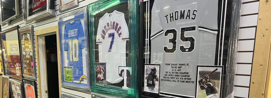 a wall of athletic jerseys for Preacherbill's Coins in Midland, TX